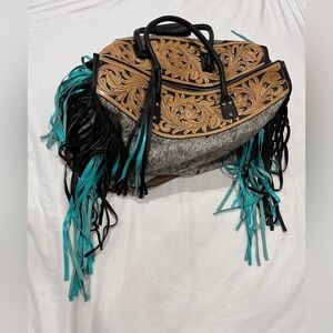Beautiful handmade duffle w tooled and hide details